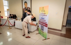 An officer of Assam Police registering through QR code for conference on India's Progressive Path in the Administration of Criminal Justice Systems