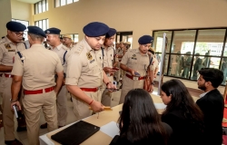 Assam Police personnel standing at registration counter for conference on India's Progressive Path in the Administration of Criminal Justice System